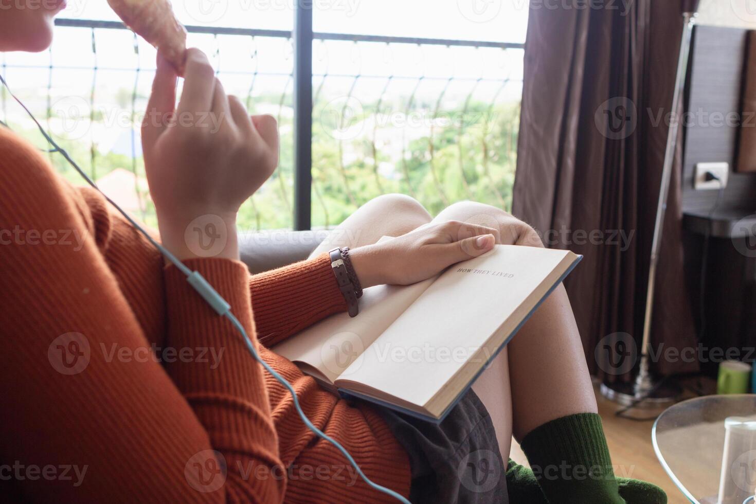 girl intently read textbook in her hand to understand and learn the lessons from Textbook she received from teacher. concept for learning and reviewing lessons for understanding during the holidays. photo