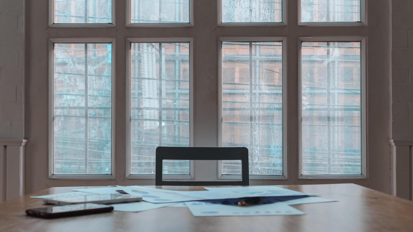Annual earnings reports are placed on table in the conference room to prepare the paperwork for the board and investors to review annual earnings to adjust and make business plans for the coming year. photo