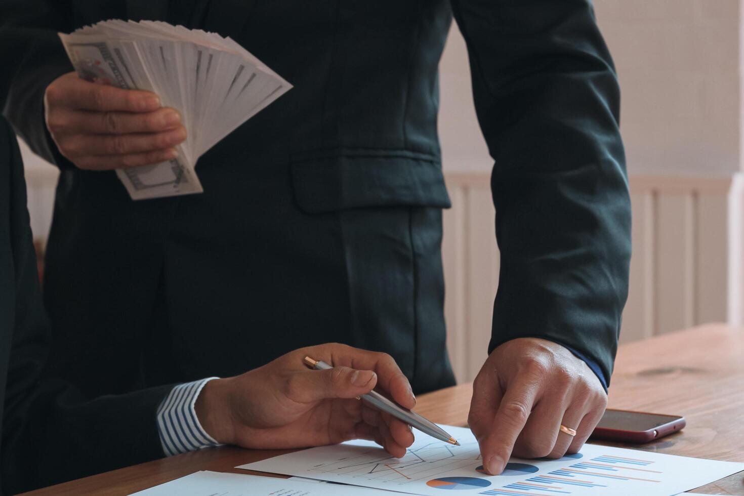 Annual earnings reports are placed on table in the conference room to prepare the paperwork for the board and investors to review annual earnings to adjust and make business plans for the coming year. photo