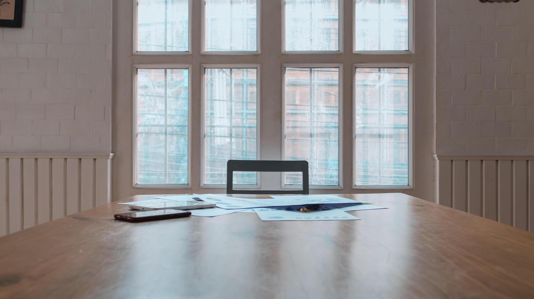 Annual earnings reports are placed on table in the conference room to prepare the paperwork for the board and investors to review annual earnings to adjust and make business plans for the coming year. photo