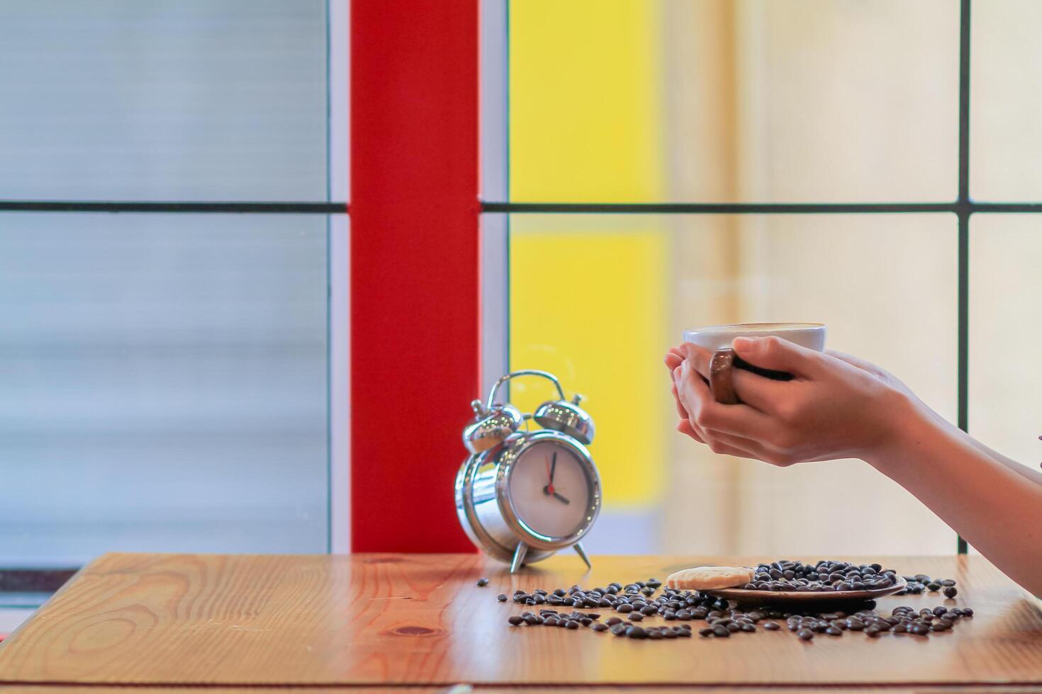 Soft Light,A businesswoman is holding a cup of coffee to drink hot coffee in the morning to prepare before starting to work at home.Stimulating yourself for work in the morning by drinking coffee photo
