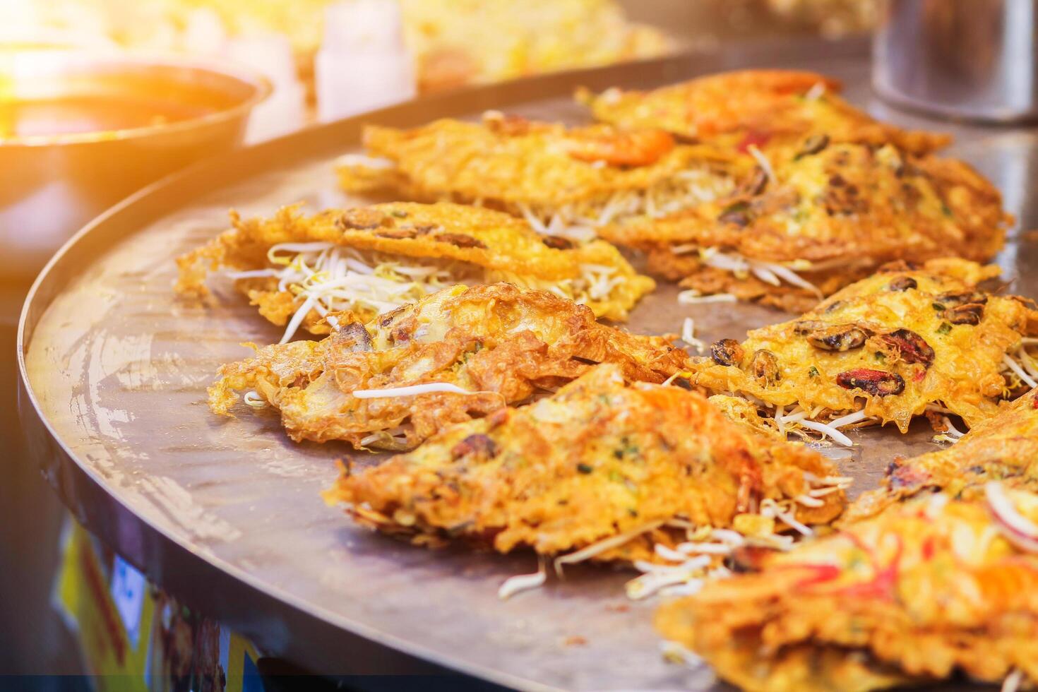 Blurred images of Pad Thai menu,Pad Thai is a ready-to-eat food that is popular on the Walking Street or Street Food in Thailand because Pad Thai is easy to carry and easy to eat when walking. photo