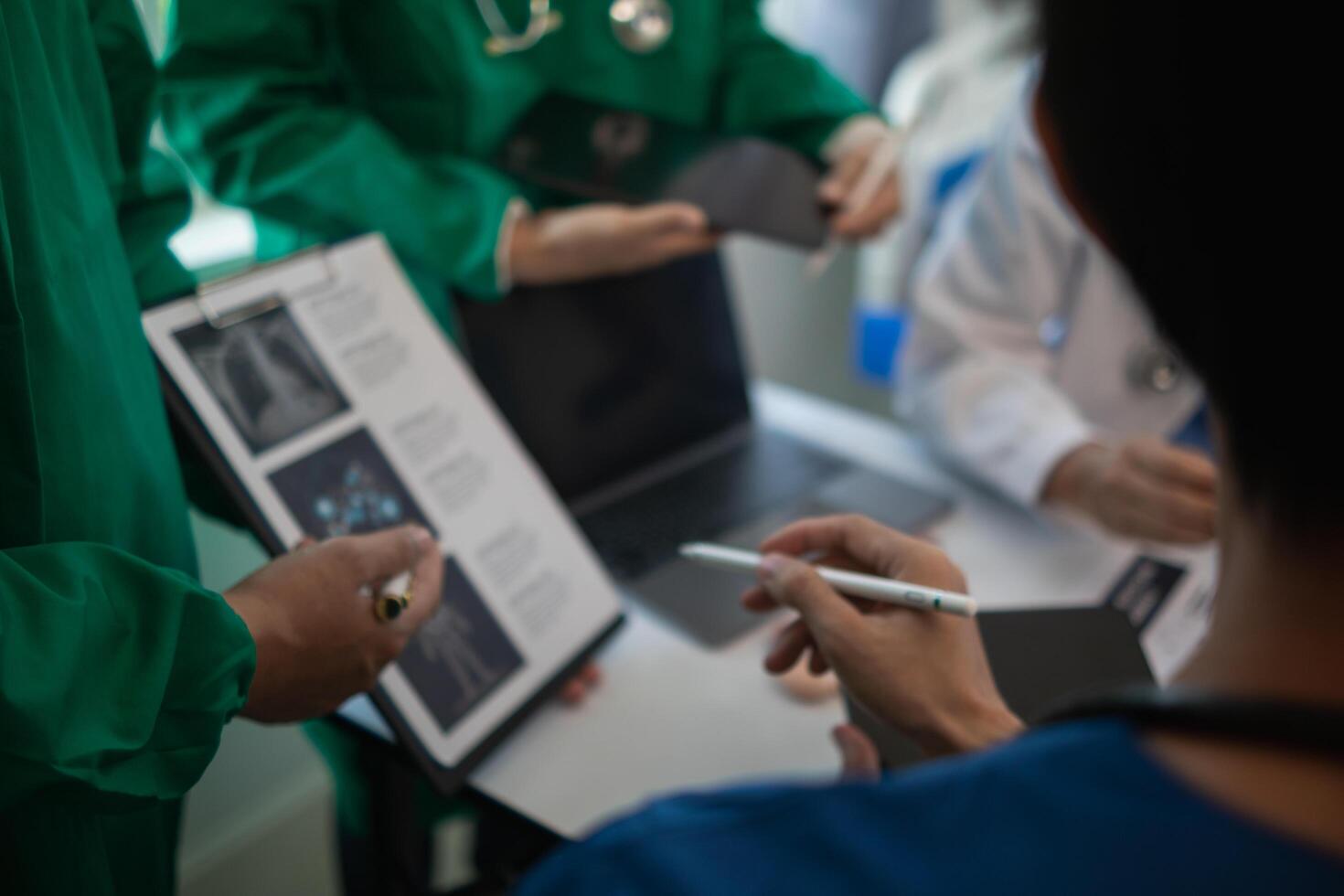 concept of mobilizing ability of medical team in conference room to diagnose and treat disease correctly. medical team joins meeting and discusses patient illness in order to treat it correctly photo