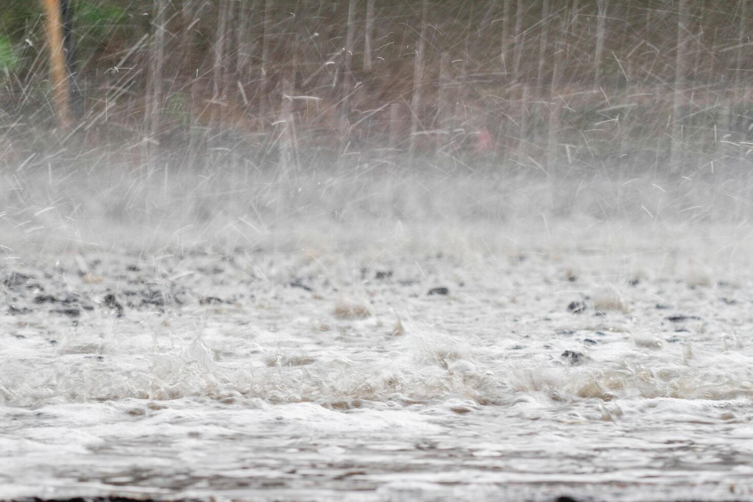 The rain was falling on the roadway due to a precipitation that was forming after the depression hit Thailand, causing heavy rains in some areas and flooding the road surface. photo