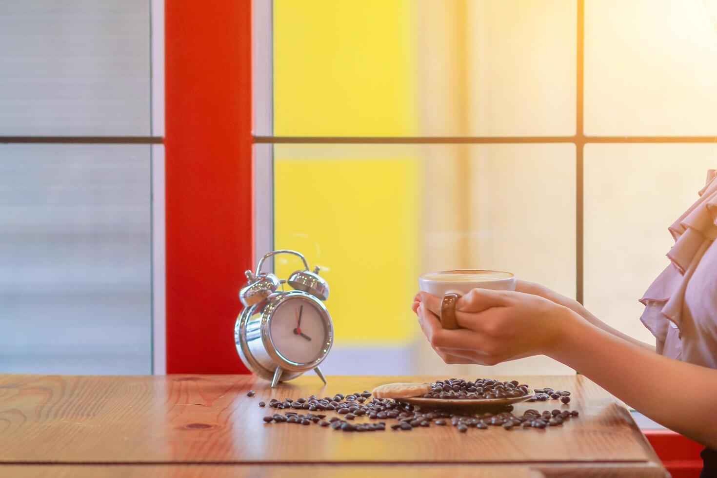 Soft Light,A businesswoman is holding a cup of coffee to drink hot coffee in the morning to prepare before starting to work at home.Stimulating yourself for work in the morning by drinking coffee photo