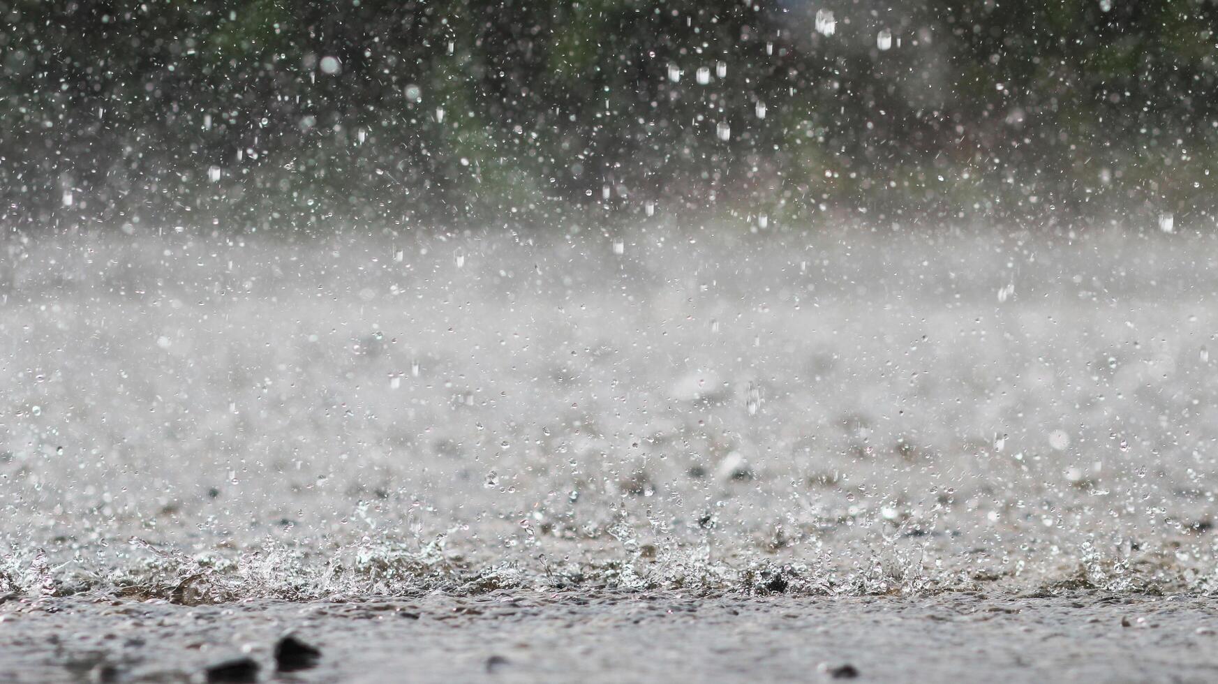 The rain was falling on the roadway due to a precipitation that was forming after the depression hit Thailand, causing heavy rains in some areas and flooding the road surface. photo