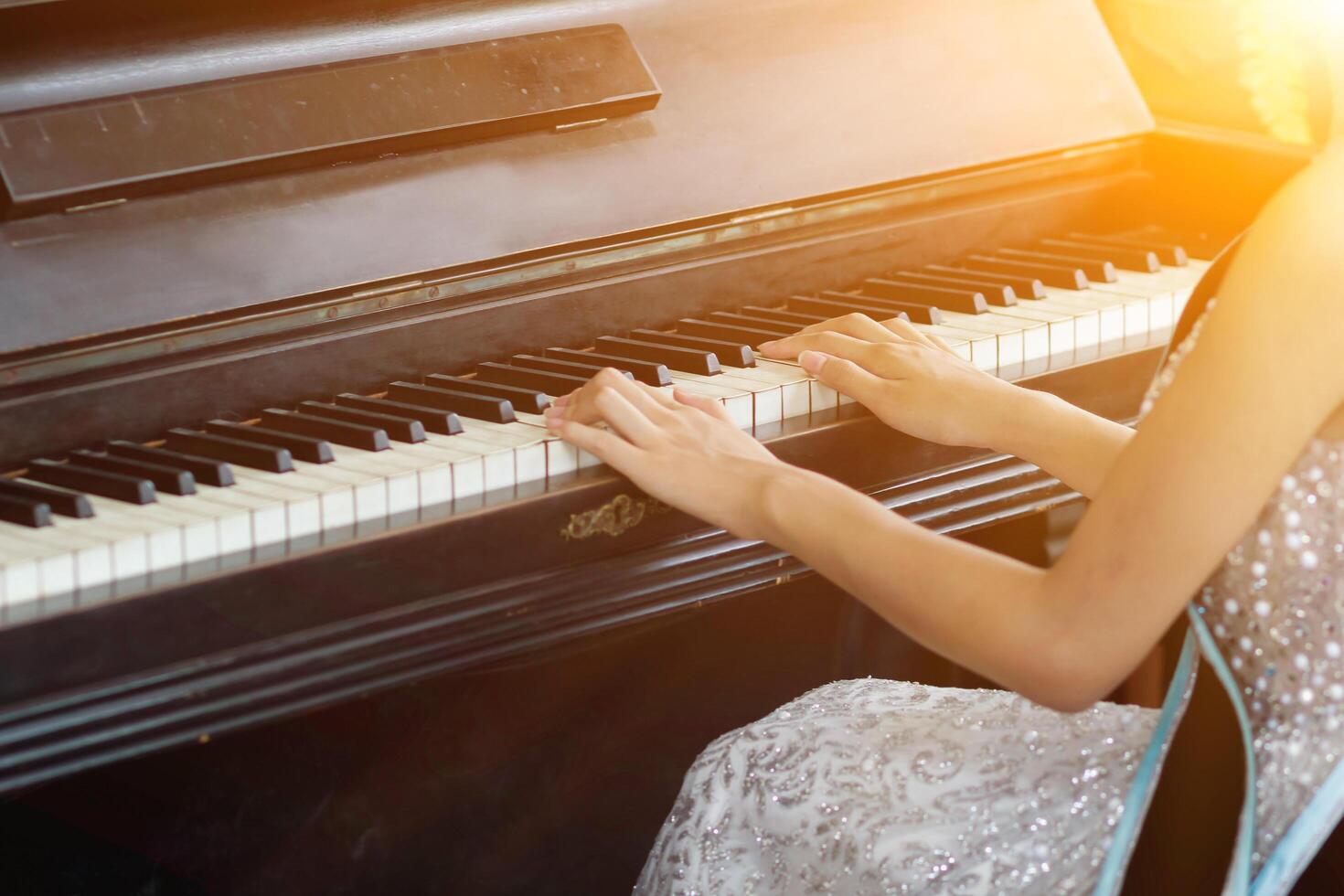Beautiful piano background are set by the window in the morning waiting for the pianist to come to practice in the morning to reduce the mistake of having to perform the piano performance at a concert photo