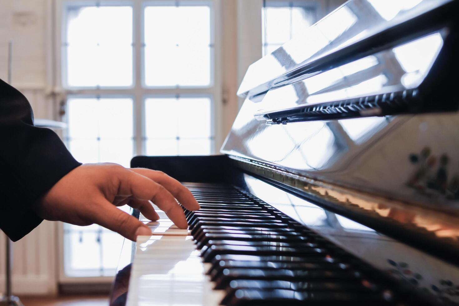 Beautiful piano background are set by the window in the morning waiting for the pianist to come to practice in the morning to reduce the mistake of having to perform the piano performance at a concert photo