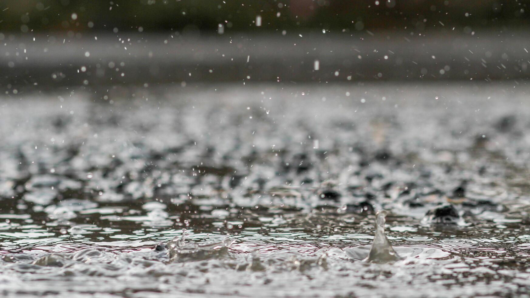 The rain was falling on the roadway due to a precipitation that was forming after the depression hit Thailand, causing heavy rains in some areas and flooding the road surface. photo