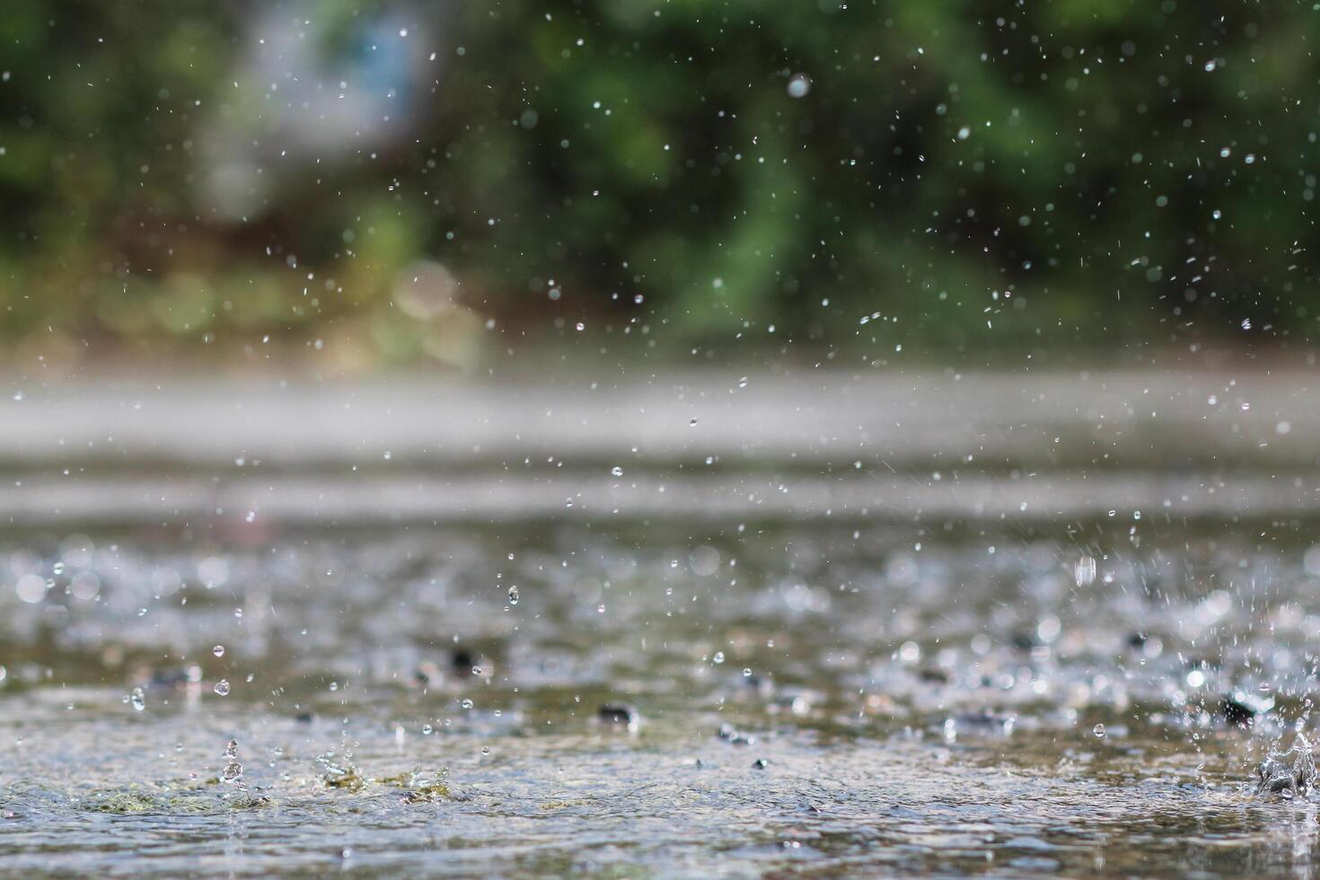 The rain was falling on the roadway due to a precipitation that was forming after the depression hit Thailand, causing heavy rains in some areas and flooding the road surface. photo