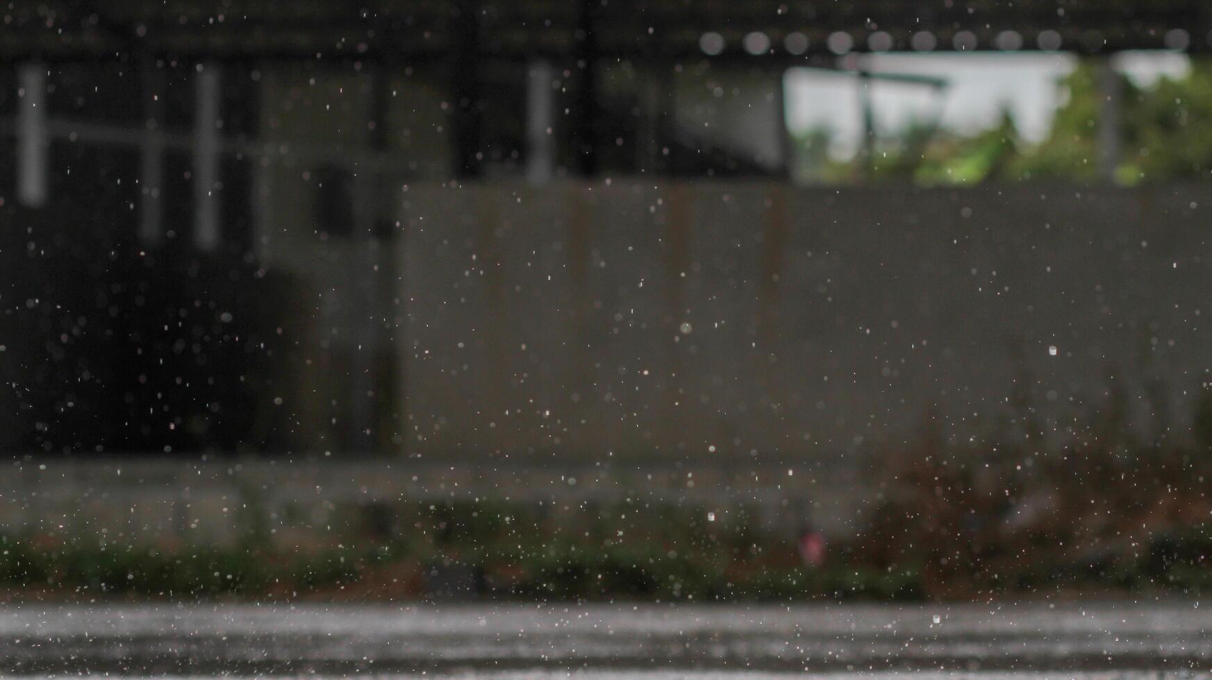 The rain was falling on the roadway due to a precipitation that was forming after the depression hit Thailand, causing heavy rains in some areas and flooding the road surface. photo