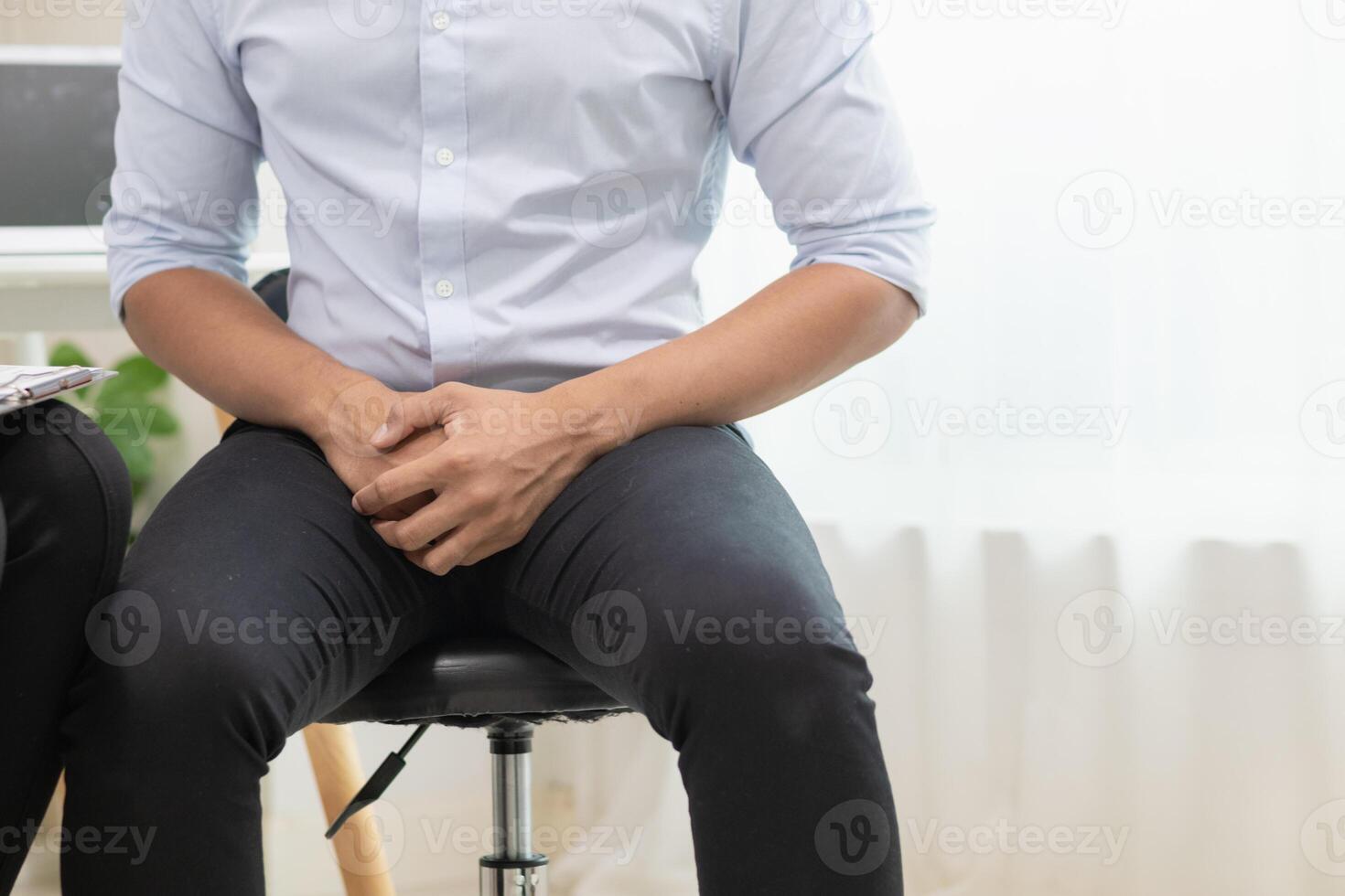 A young man was diagnosed with a tumor in his prostate and the medical team diagnosed him with prostate cancer and provided counseling to health care patients to undergo cancer treatment and surgery. photo