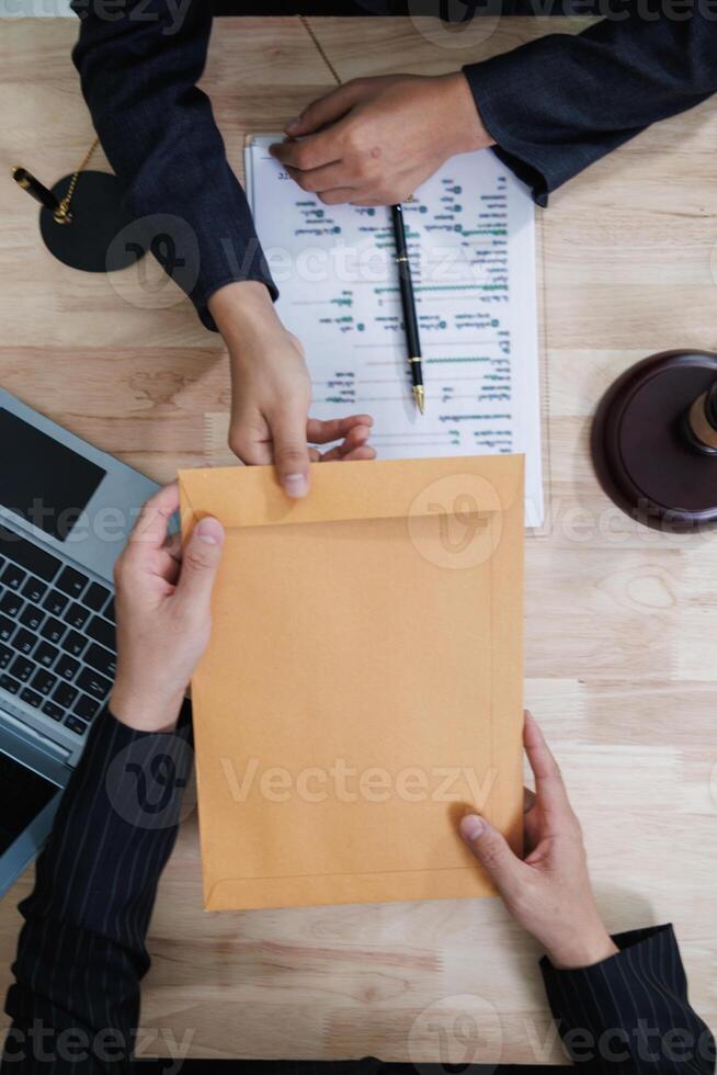 client meets with a lawyer within the legal counsel office to request advice about law and lawsuit that will be filed in order to obtain an advantageous outcome in lawsuit. legal counsel concept photo