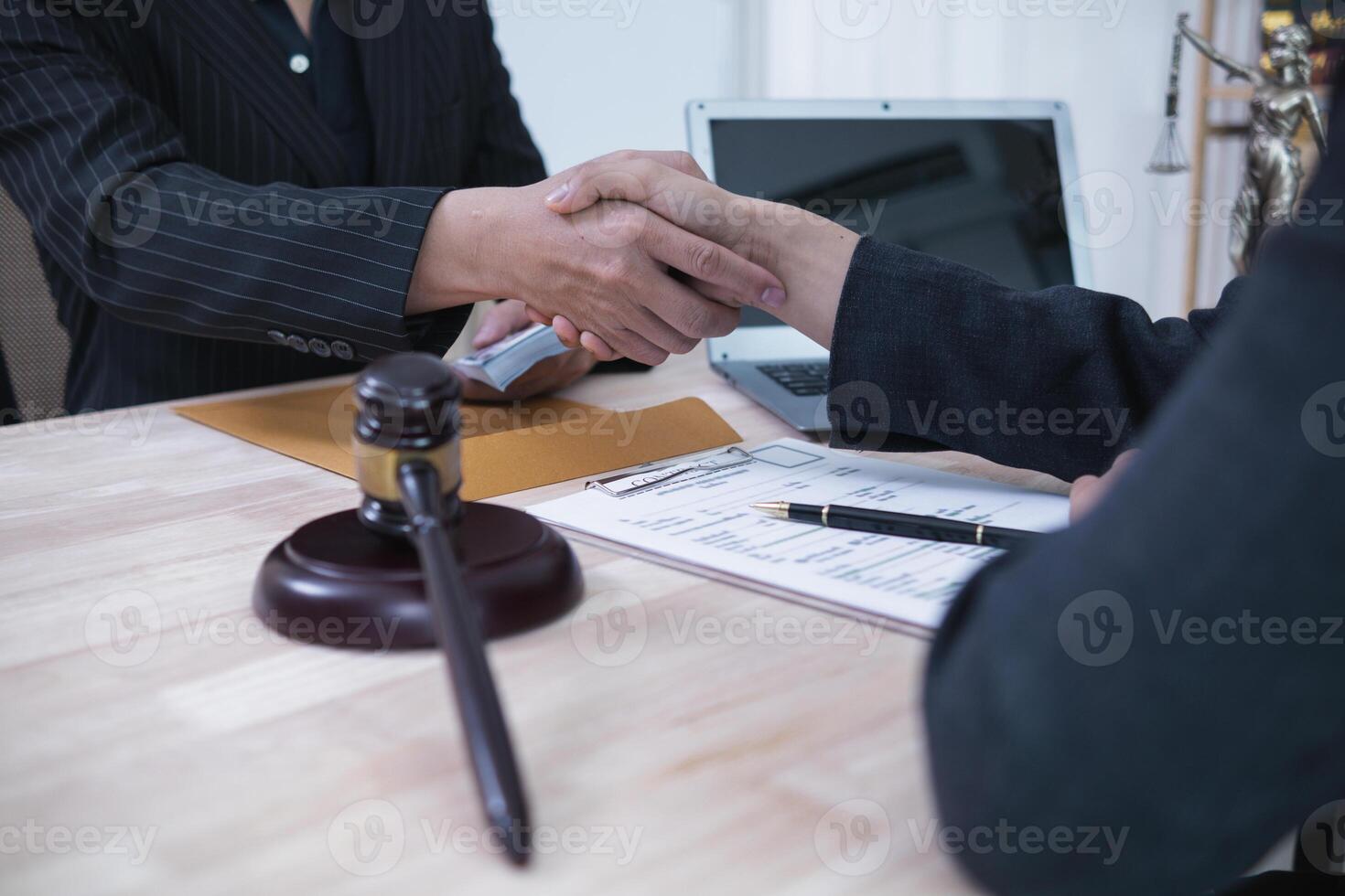The businessman offered cash to prosecutors as a bribe to help change the verdict in the case, knowing that bribery is a serious and illegal crime. The concept of bribing government officials photo