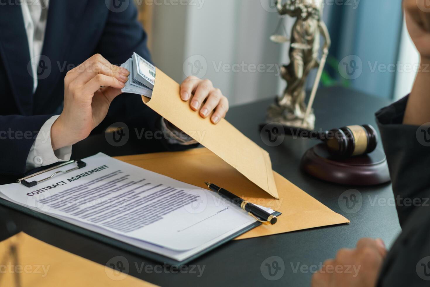 The businessman offered cash to prosecutors as a bribe to help change the verdict in the case, knowing that bribery is a serious and illegal crime. The concept of bribing government officials photo