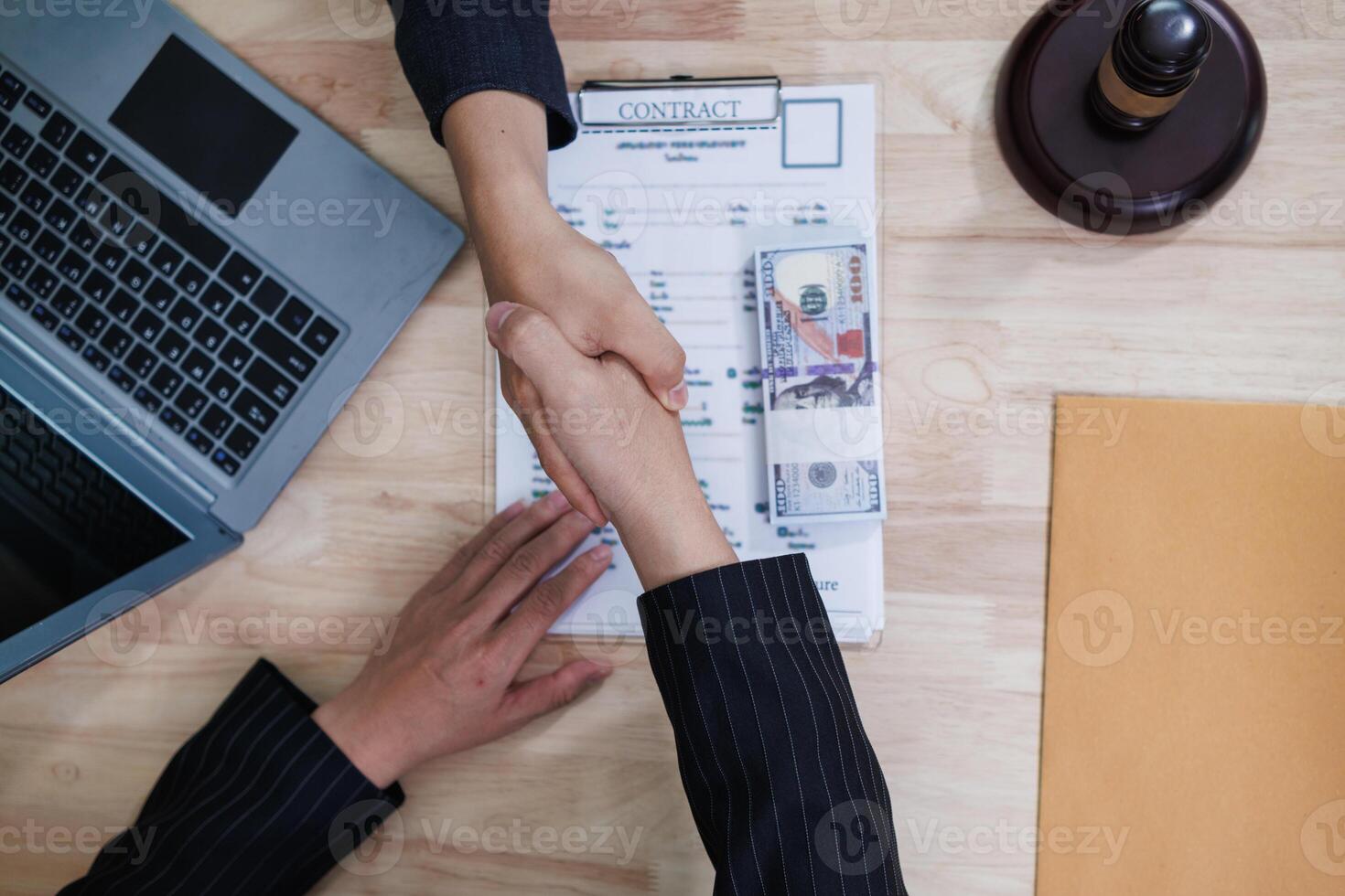 The businessman offered cash to prosecutors as a bribe to help change the verdict in the case, knowing that bribery is a serious and illegal crime. The concept of bribing government officials photo