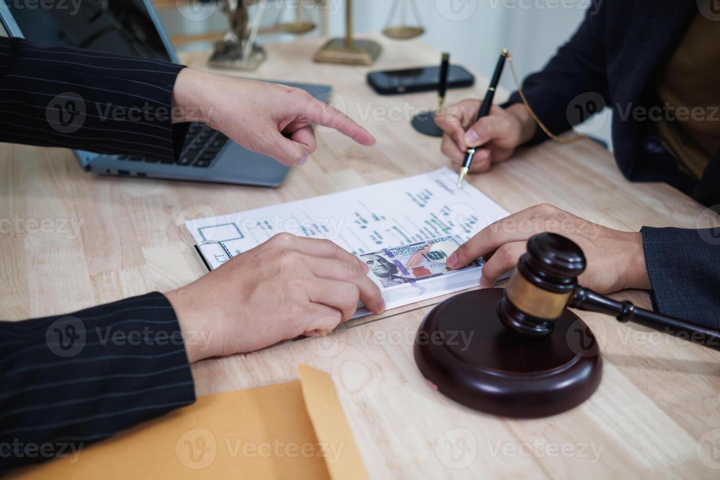 The businessman offered cash to prosecutors as a bribe to help change the verdict in the case, knowing that bribery is a serious and illegal crime. The concept of bribing government officials photo