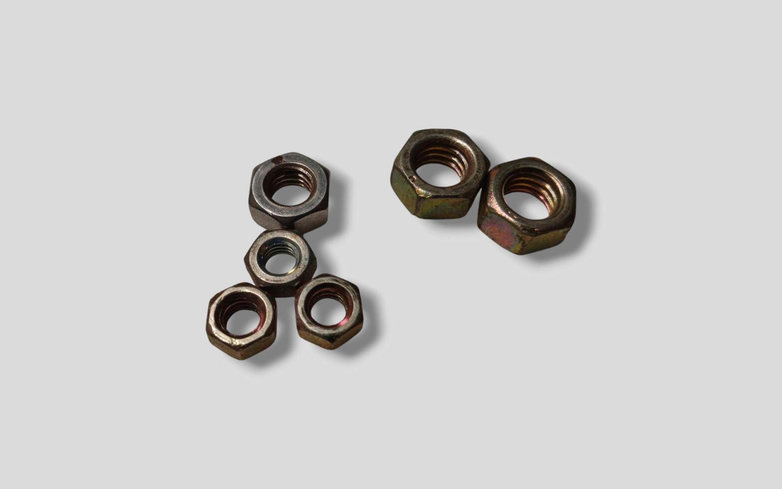 Macro image of metal nut isolated on white background. Steel nut isolated. Tools for work. photo