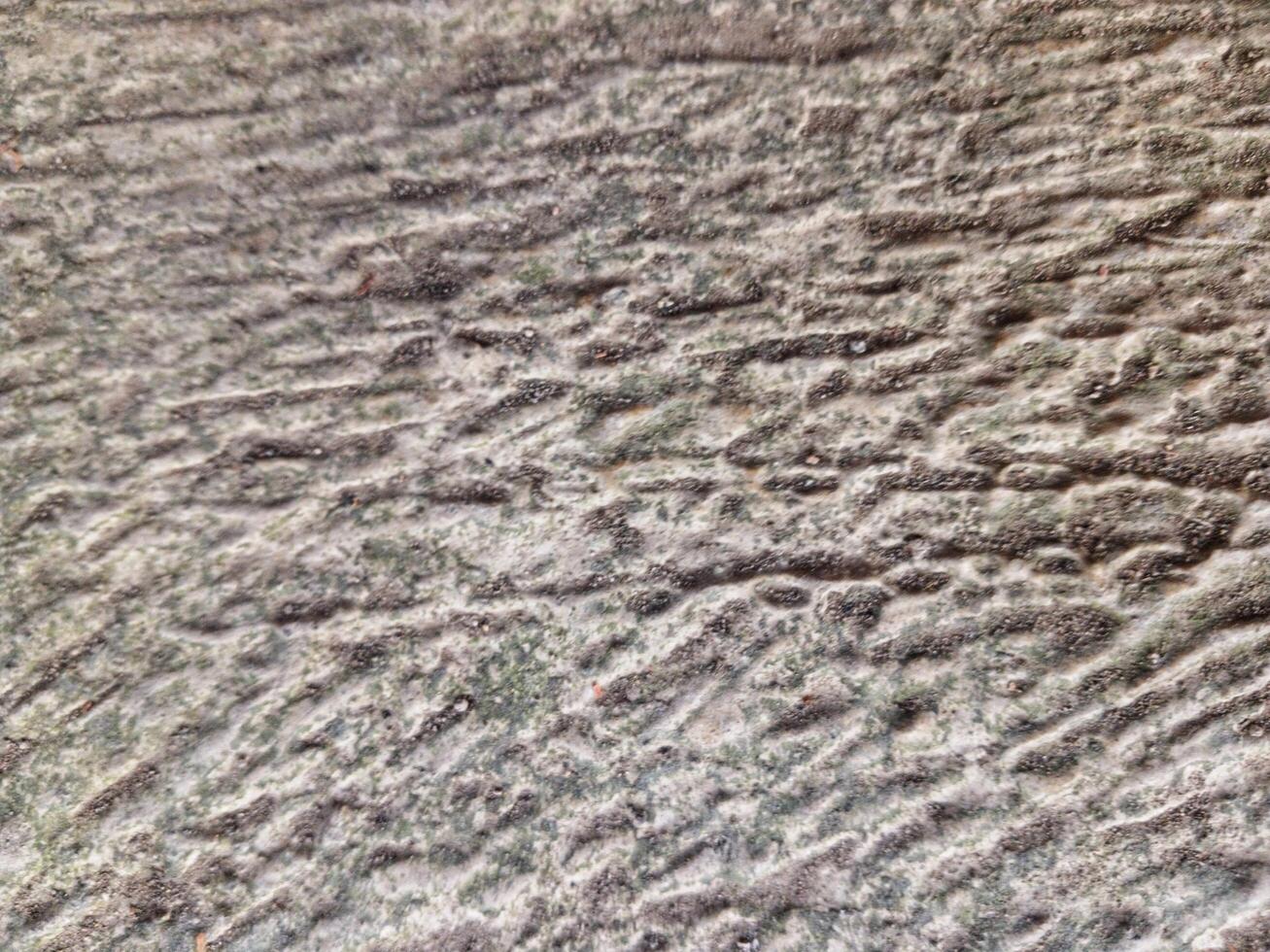Rough texture background of building wall taken close up. Suitable for additional design projects. photo