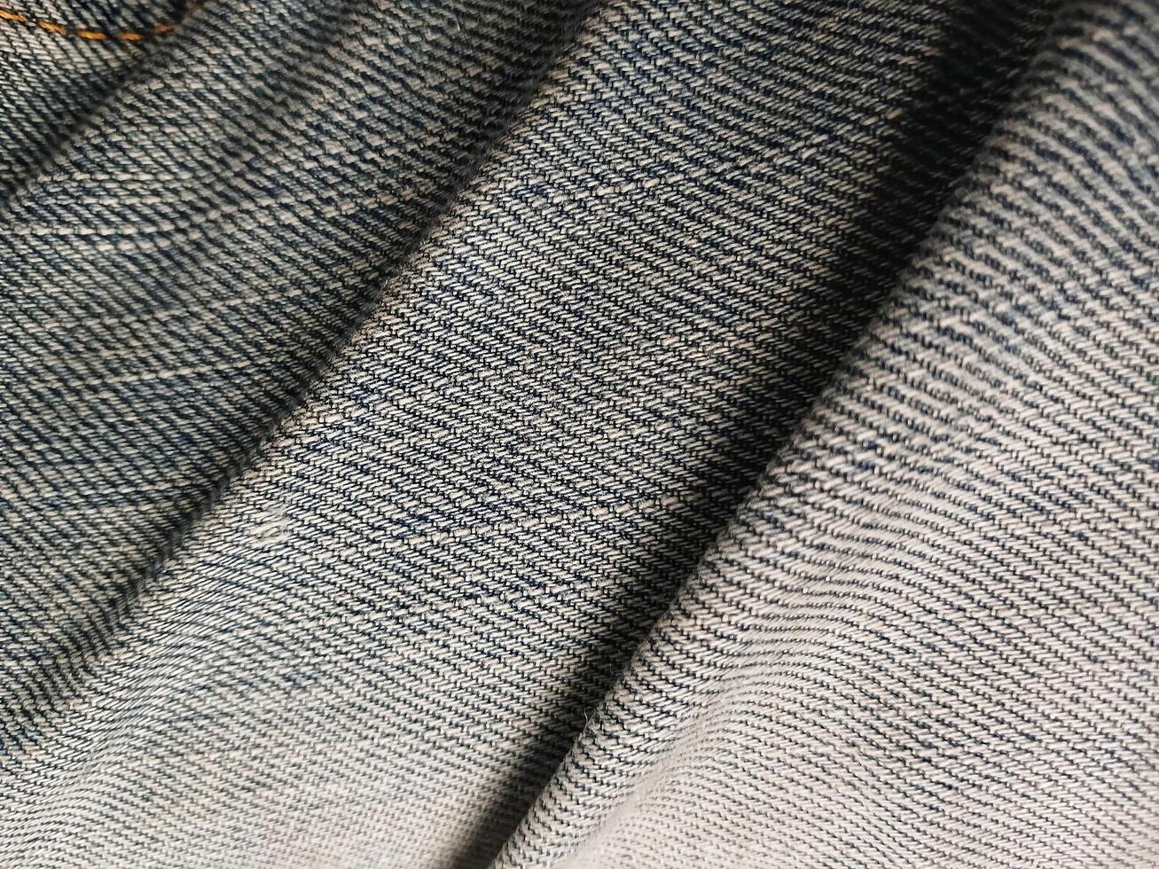 Rough fabric background texture. Suitable for clothing advertising additional design projects. photo