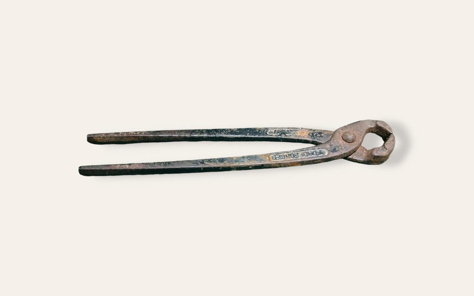 Black pliers isolated on white background. Electrical equipment, work tools. photo