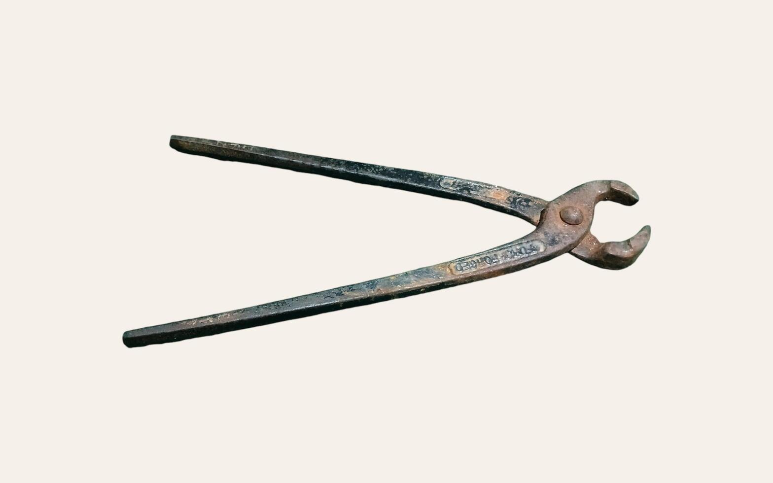 Black pliers isolated on white background. Electrical equipment, work tools. photo