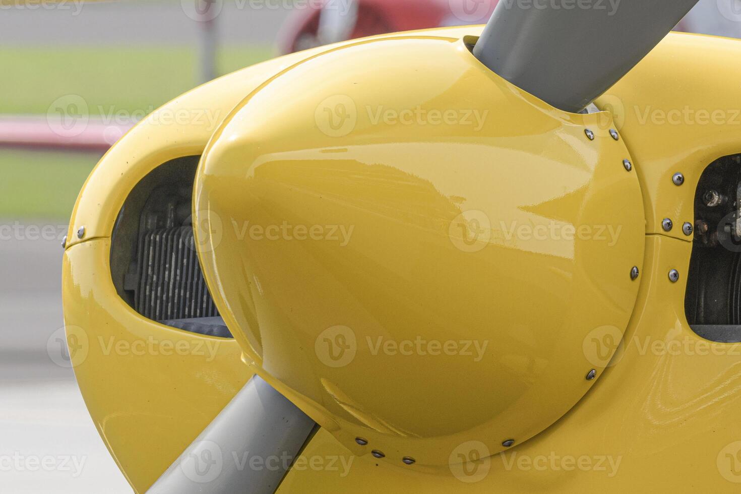 Front part of a light aircraft and propeller. Screws, texture, surface, close-up photo