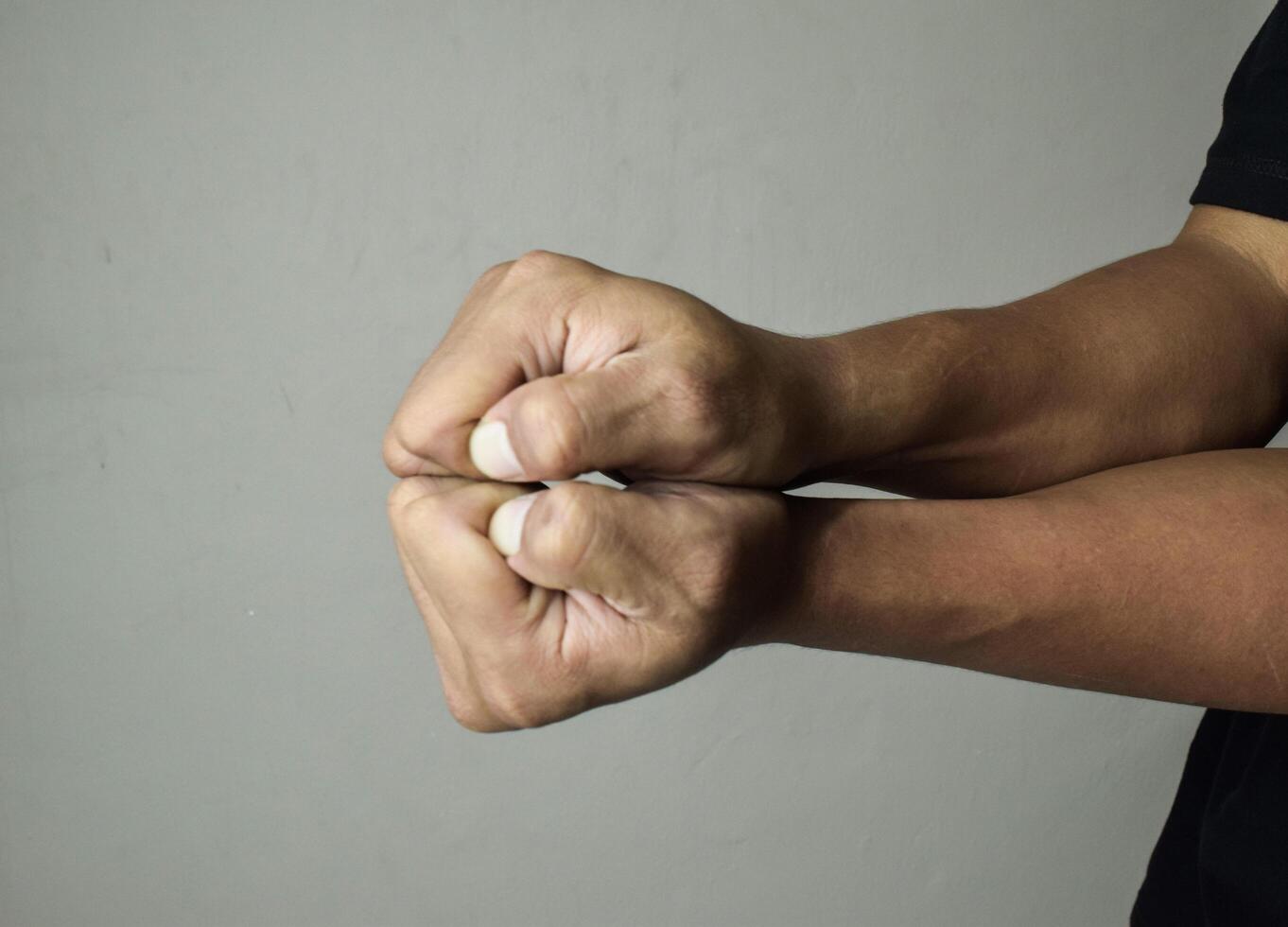 Two hands clasped together illustrating unity and teamwork. Gesture of Power and Respect photo