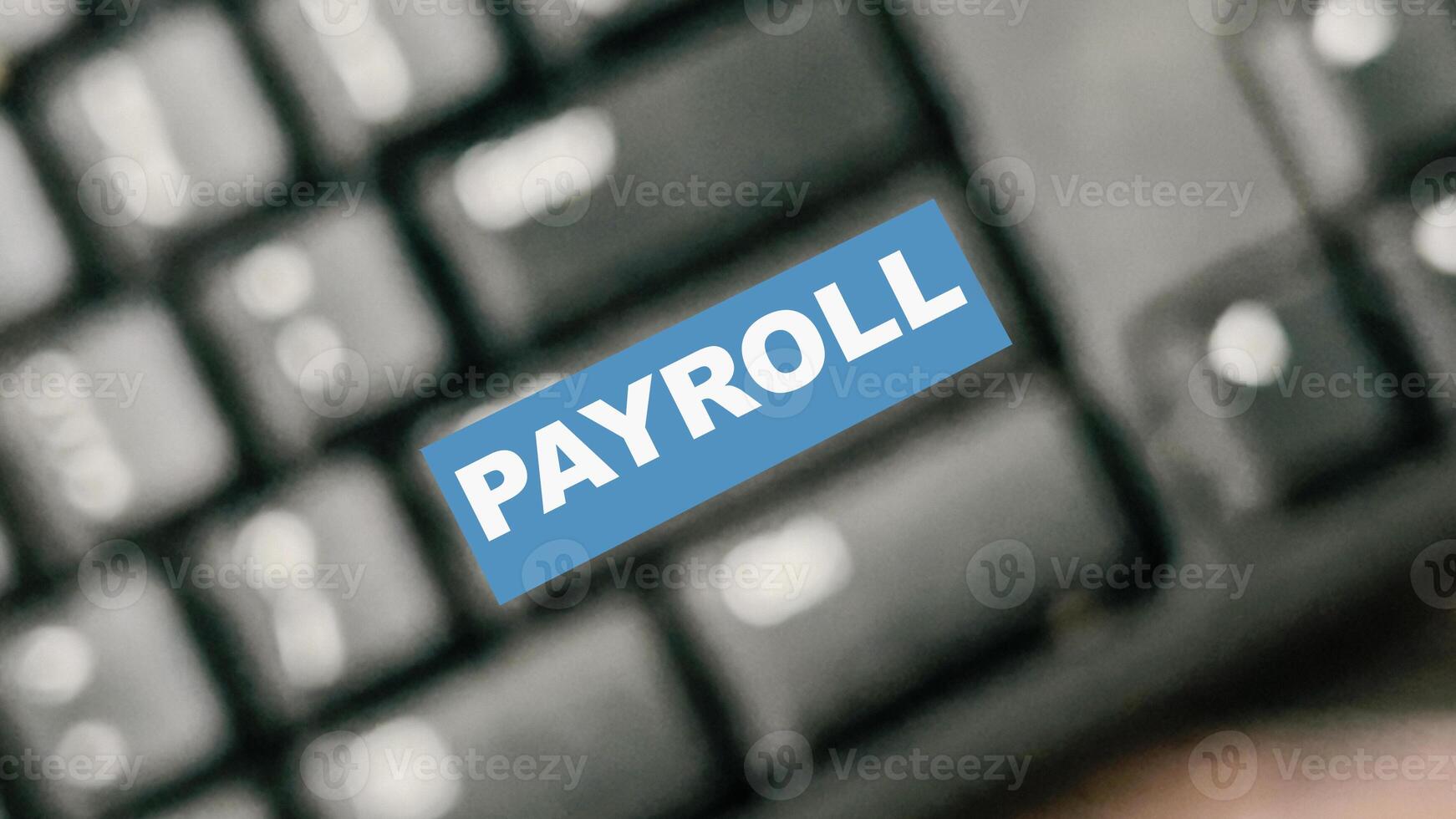 Payroll write on blur keyboard isolated on laptop background photo