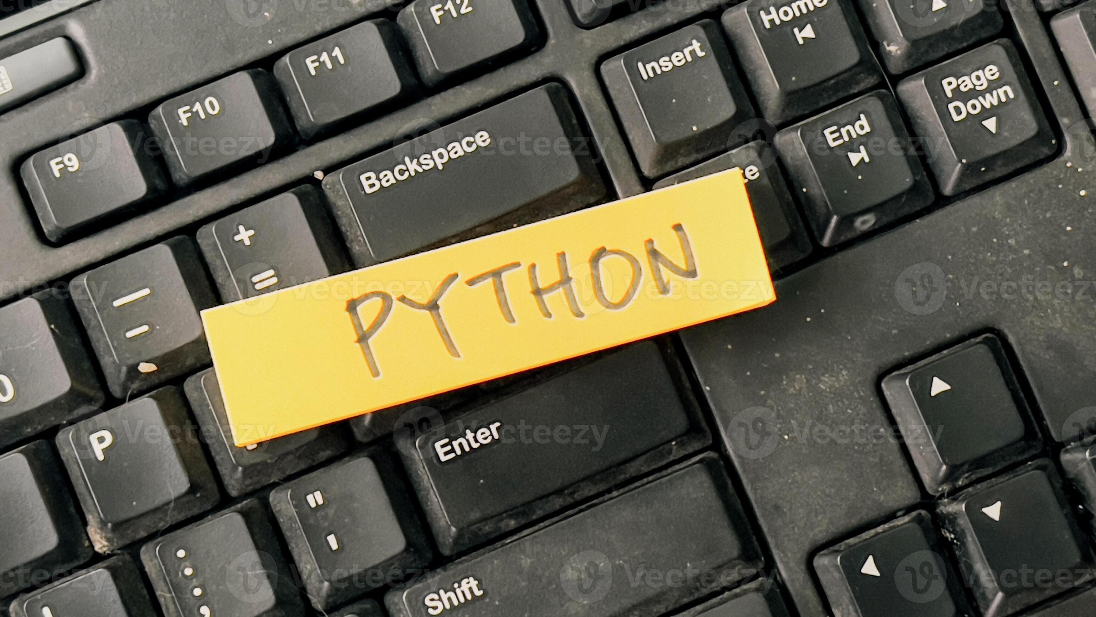 Concept of Python write on sticky notes isolated on Wooden Table ...