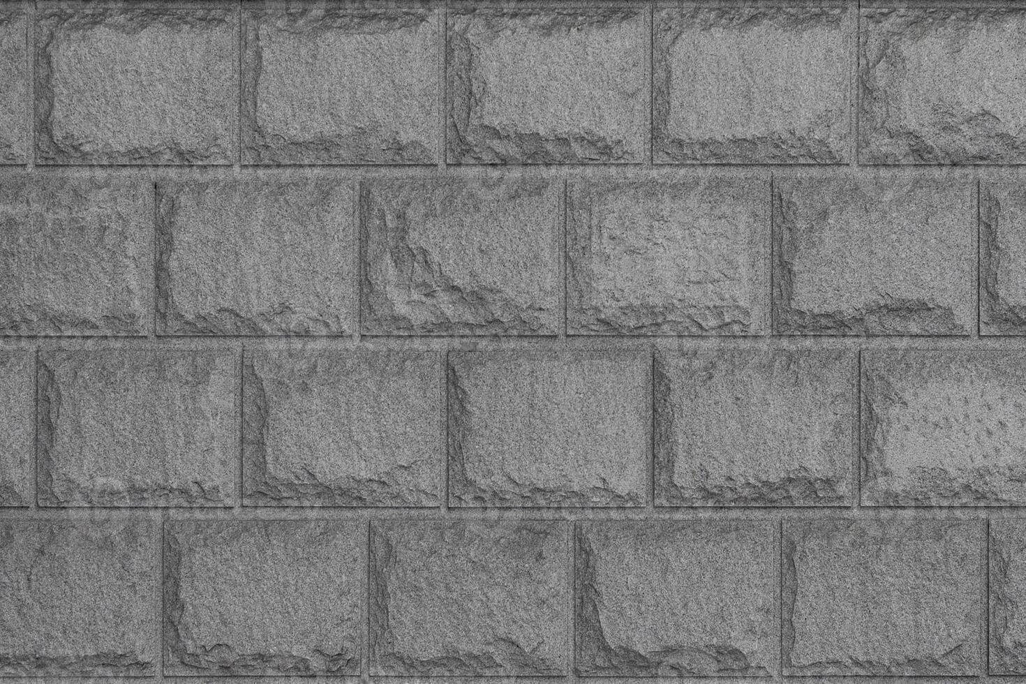 Rough gray stone bricks wall as texture, background photo