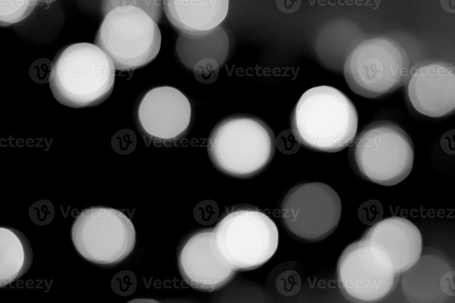 Shiny bokeh isolated on a black background photo