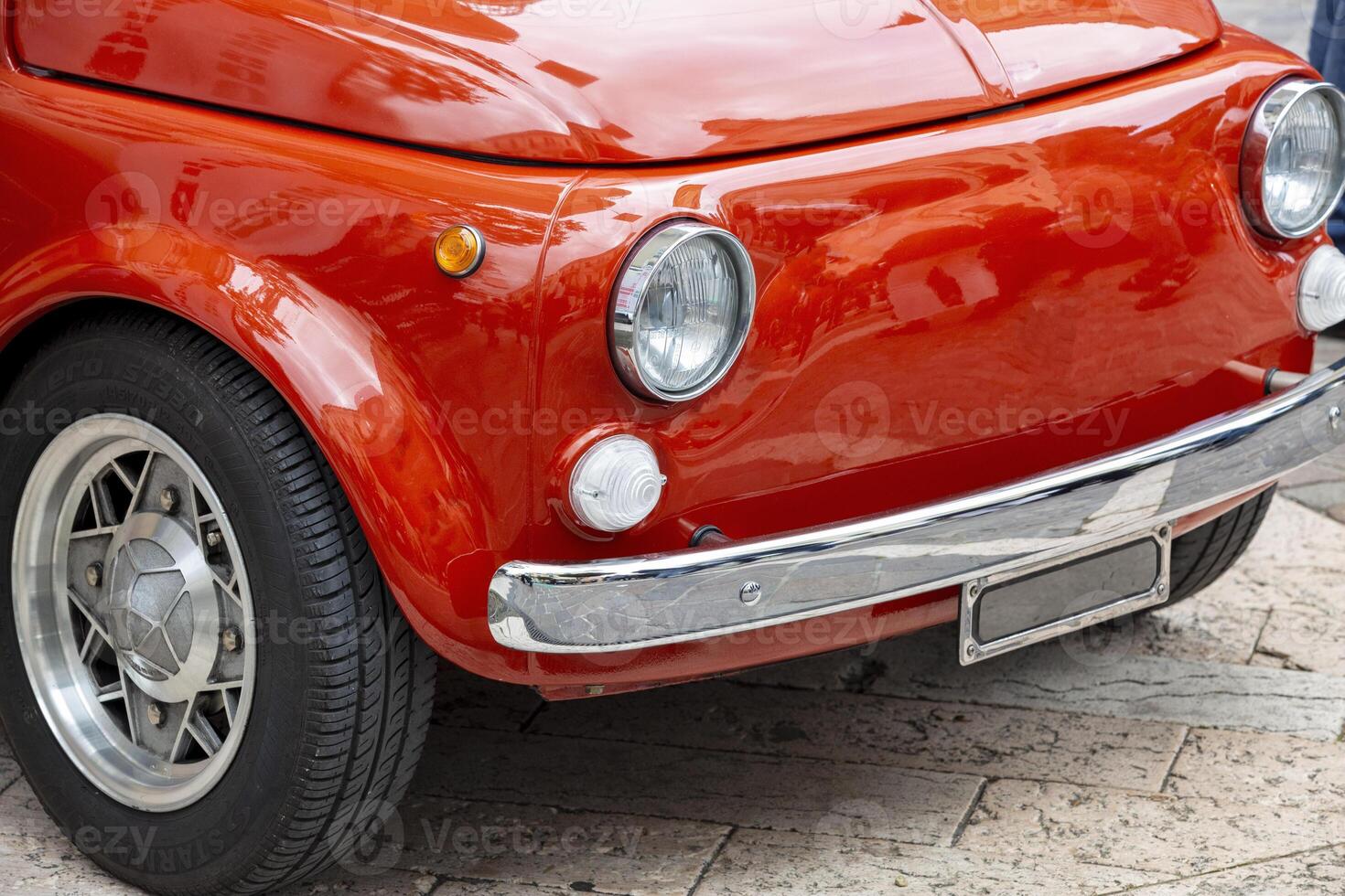 Vintage Red Classic Car Close-Up with Chrome Details and Retro Design photo