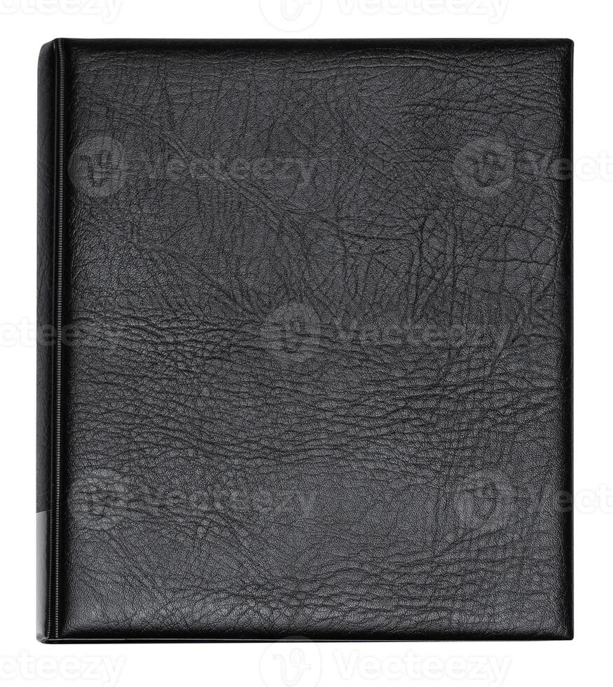 Book with black leather cover, isolated on a white background photo