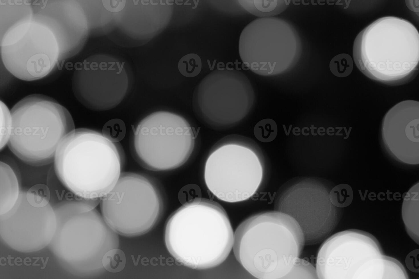 Shiny bokeh isolated on a black background photo