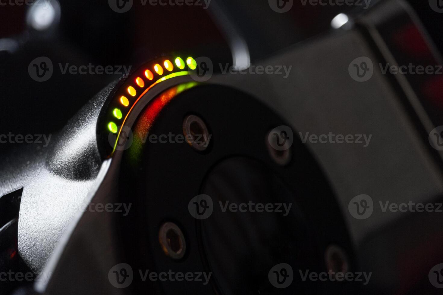 Close up view on a racing steering wheel with RPM LED indicators photo