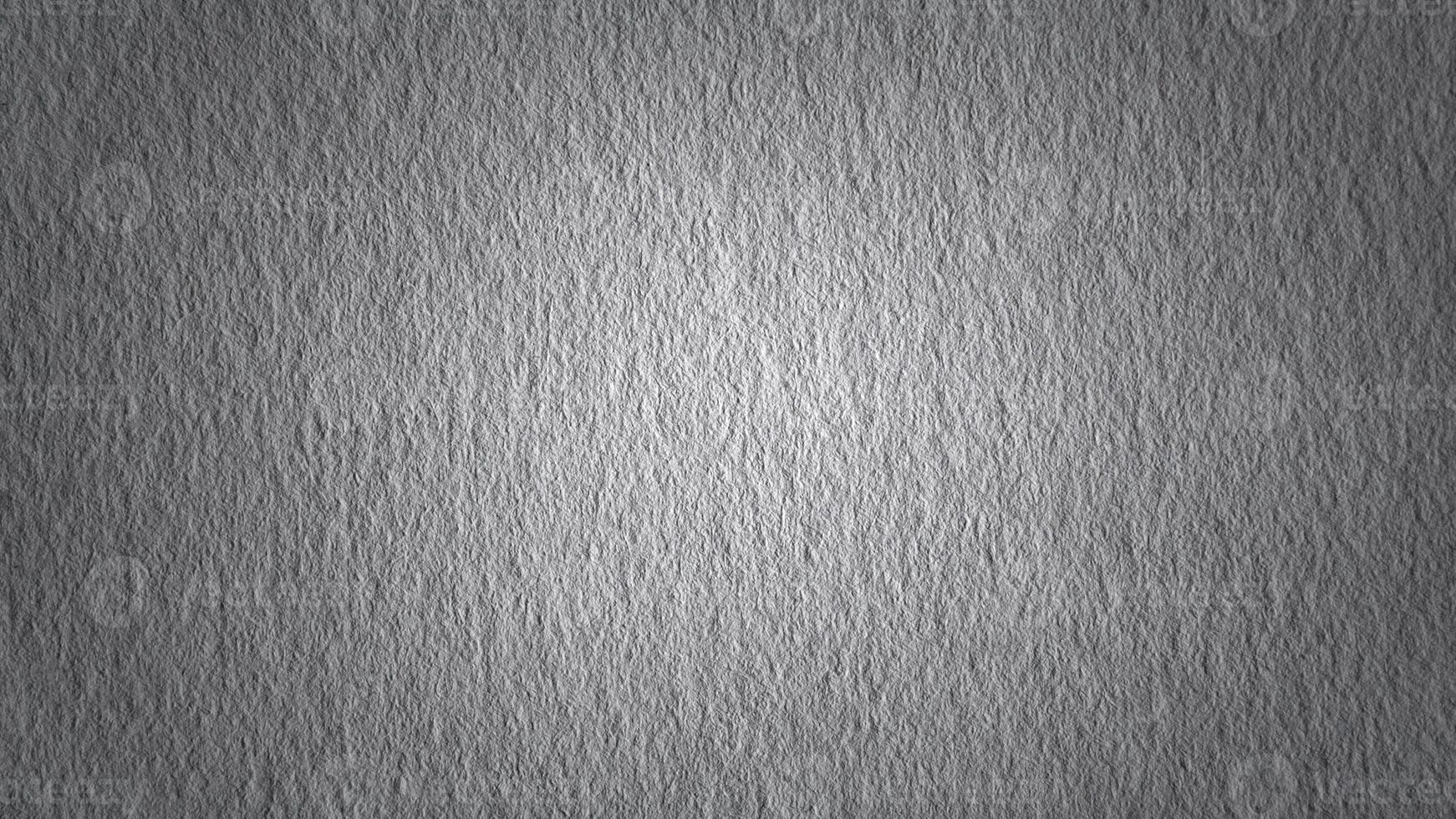 Rough gray surface with spot light as background photo