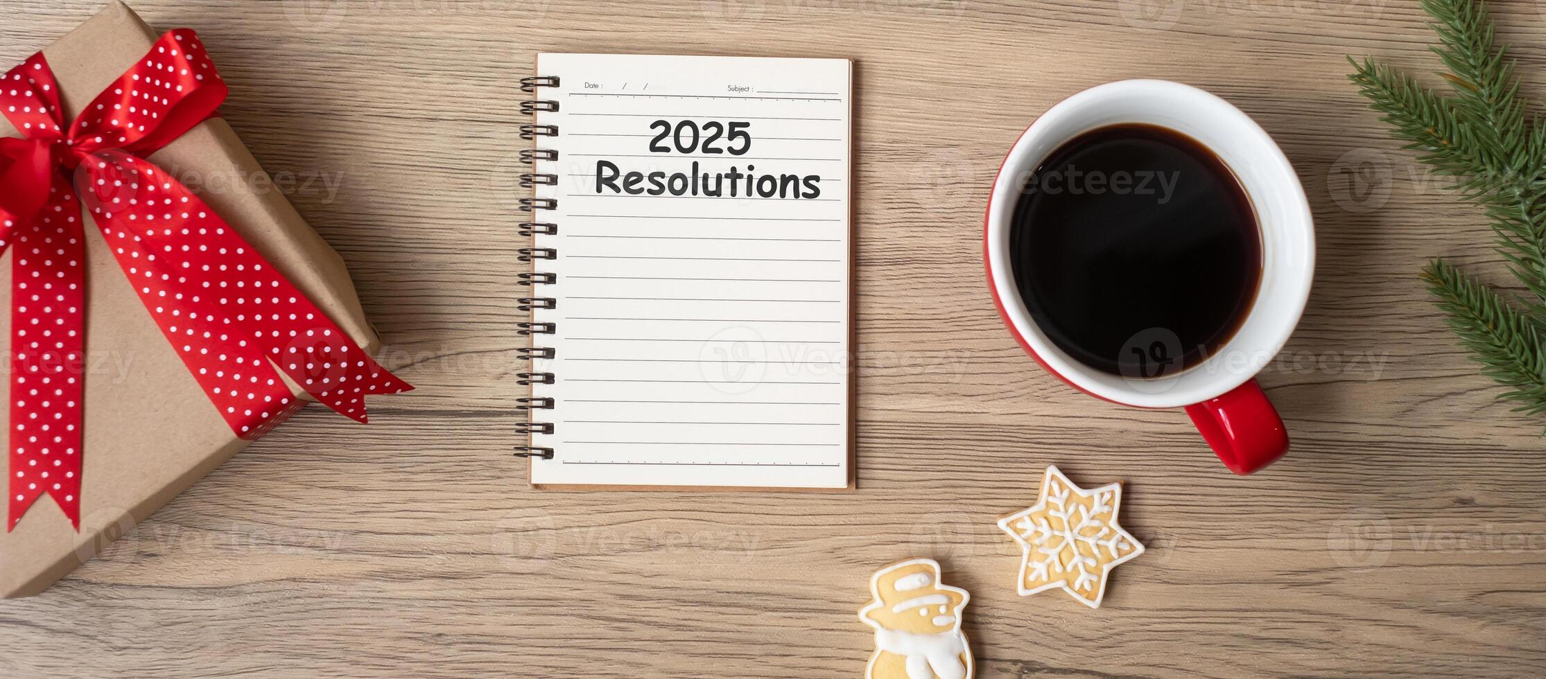 2025 Resolutions with notebook, black coffee cup, Christmas cookies and pen on wood table, Top view and copy space. Xmas, Happy New Year, Goals, To do list, Strategy and Plan concept photo