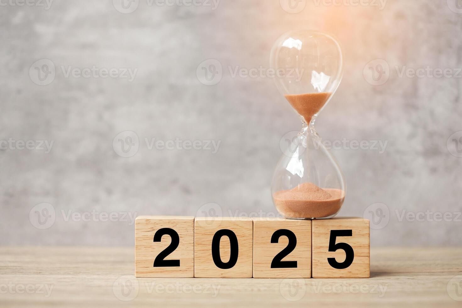 2025 text with hourglass on table. Resolution, time, plan, goal, motivation, reboot, countdown and New Year holiday concepts photo