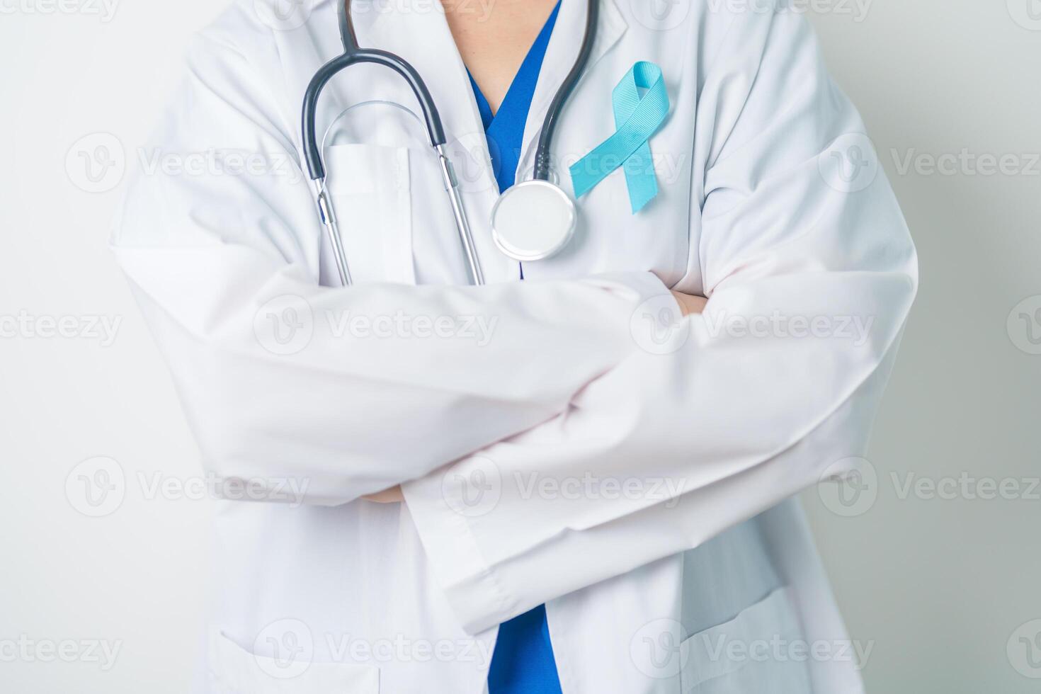 Blue November Prostate Cancer Awareness month, Doctor with Blue Ribbon in hospital for support people life and illness. Healthcare, International men, Father, Diabetes and World cancer day photo