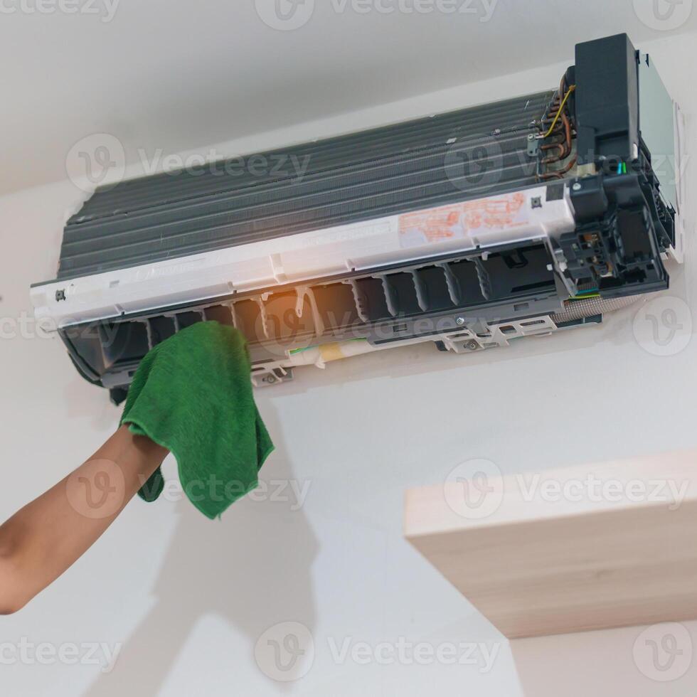 Man technician maintenance air conditioner. Purification system for cleaning dust PM2.5 and virus in home. Repair, Washing, Conditioning Service, Allergy, Pure air, health, Wellness and Air Pollution photo