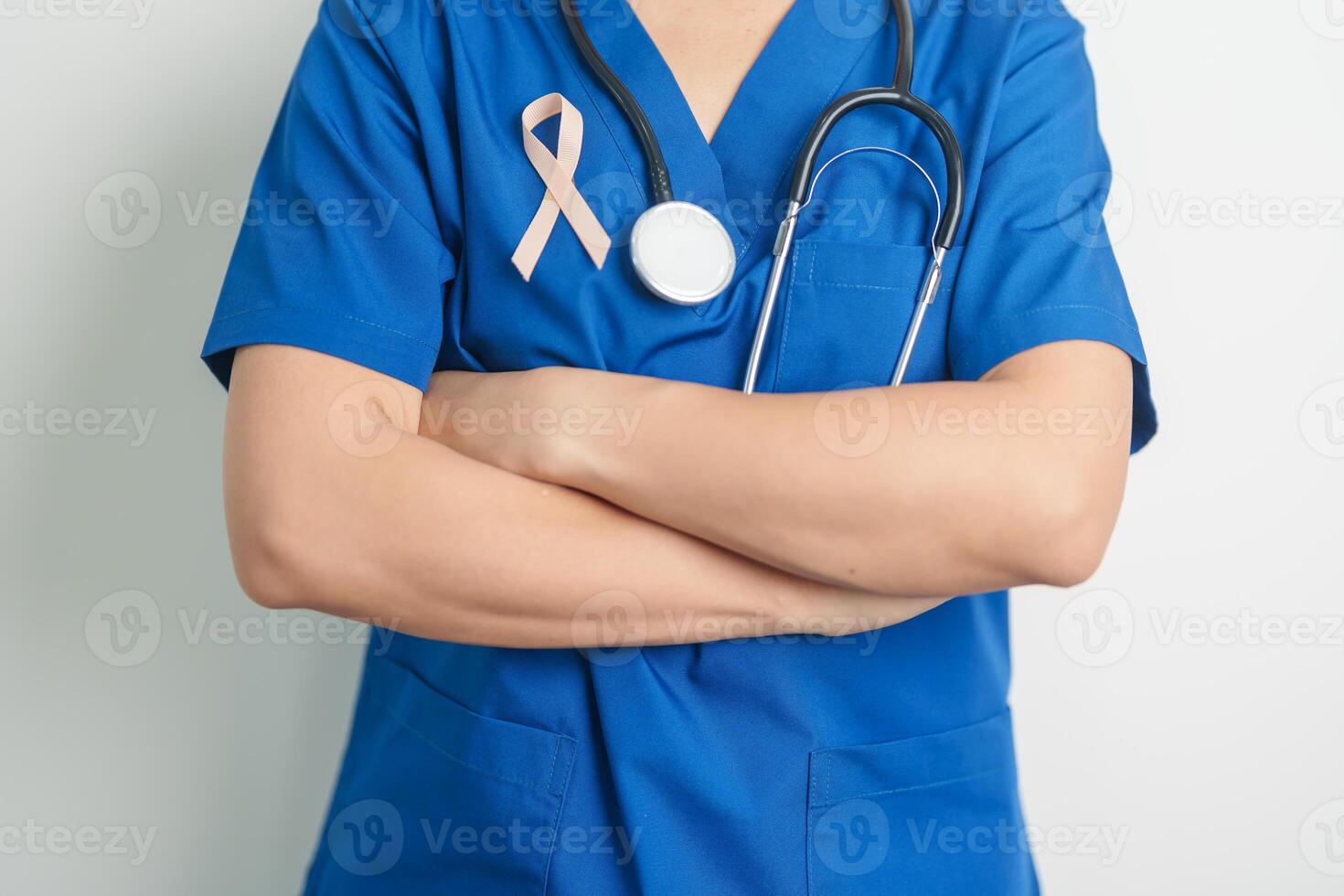 Doctor holding Peach Ribbon for September Uterine Cancer Awareness month. Uterus and Ovaries, Endometriosis, Hysterectomy, Uterine fibroids, Reproductive, Healthcare and World cancer day concept photo