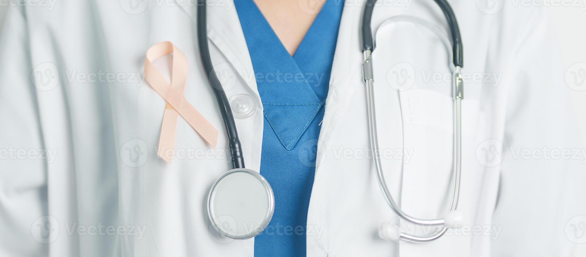 Doctor holding Peach Ribbon for September Uterine Cancer Awareness month. Uterus and Ovaries, Endometriosis, Hysterectomy, Uterine fibroids, Reproductive, Healthcare and World cancer day concept photo