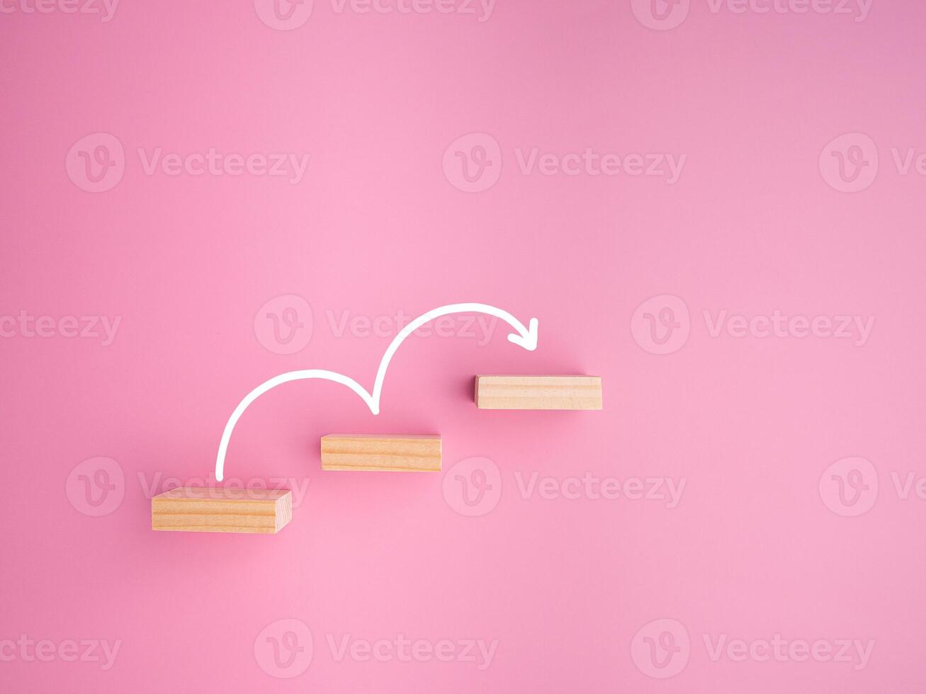 Business growth or increasing concept picture, the rising arrow on wooden blocks the staircase isolated on a pink background photo