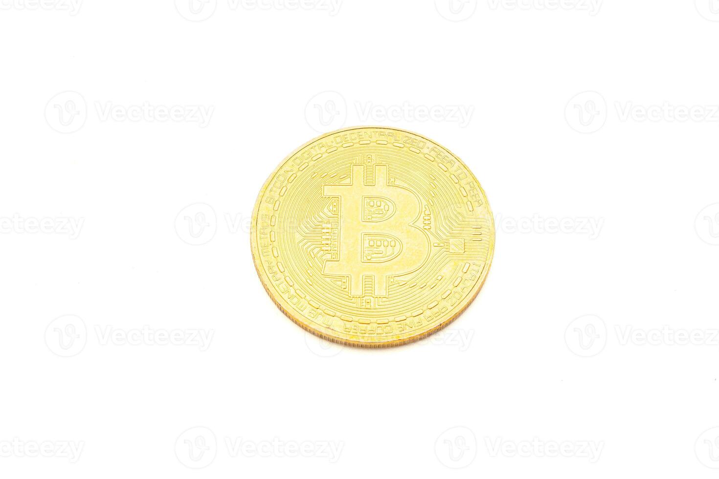 Close-up of a bitcoin golden coin on a white background. Top view. Virtual cryptocurrency and future money concept photo