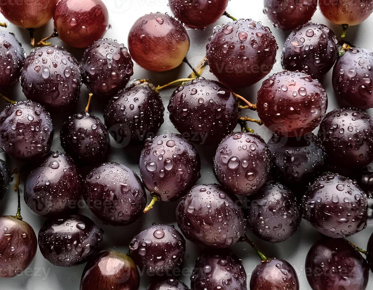 Fresh a pile of grapes against a white background adorned with glistening water droplets seamless. mock up. view. top. flat lay photo