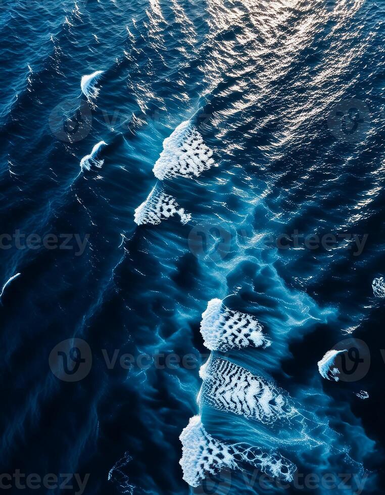 empty abstract sand beach with palm leaf shadow and transparent water wave from above, blank background banner for travel, vacation and wellbeing with copy space. top of views, aerial views. photo