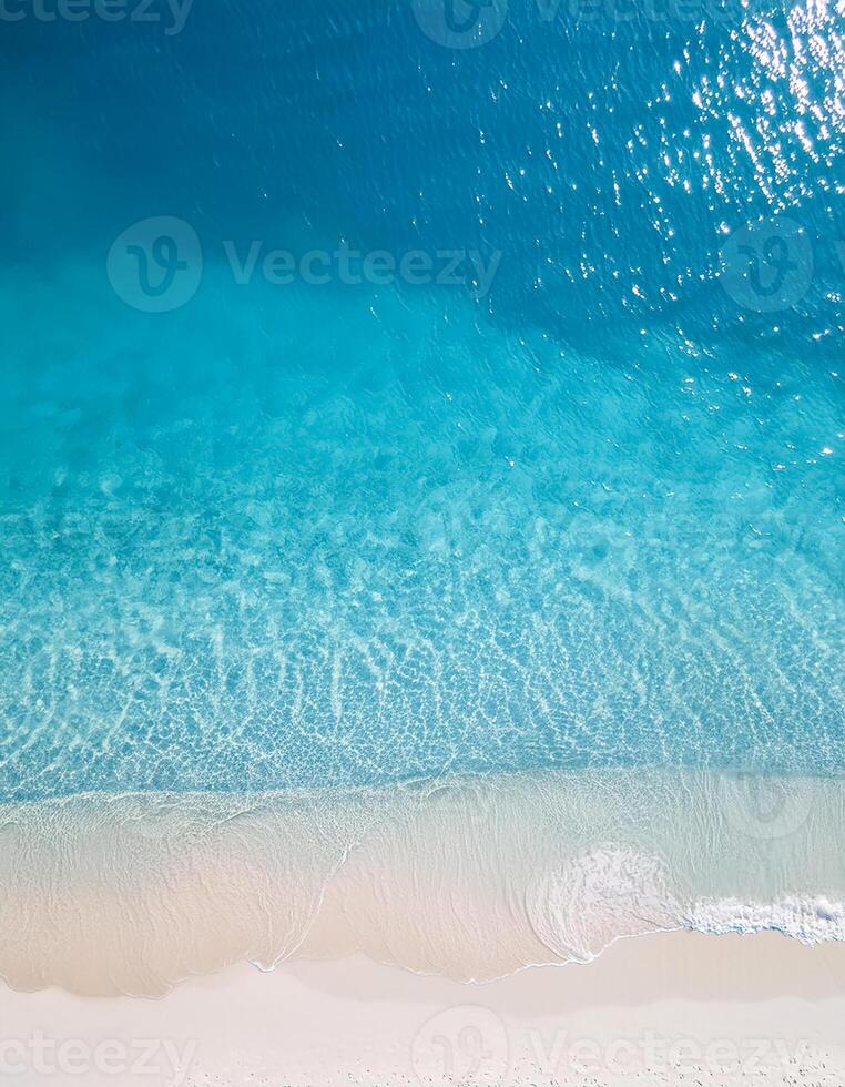 empty abstract sand beach with palm leaf shadow and transparent water wave from above, blank background banner for travel, vacation and wellbeing with copy space. top of views, aerial views. photo