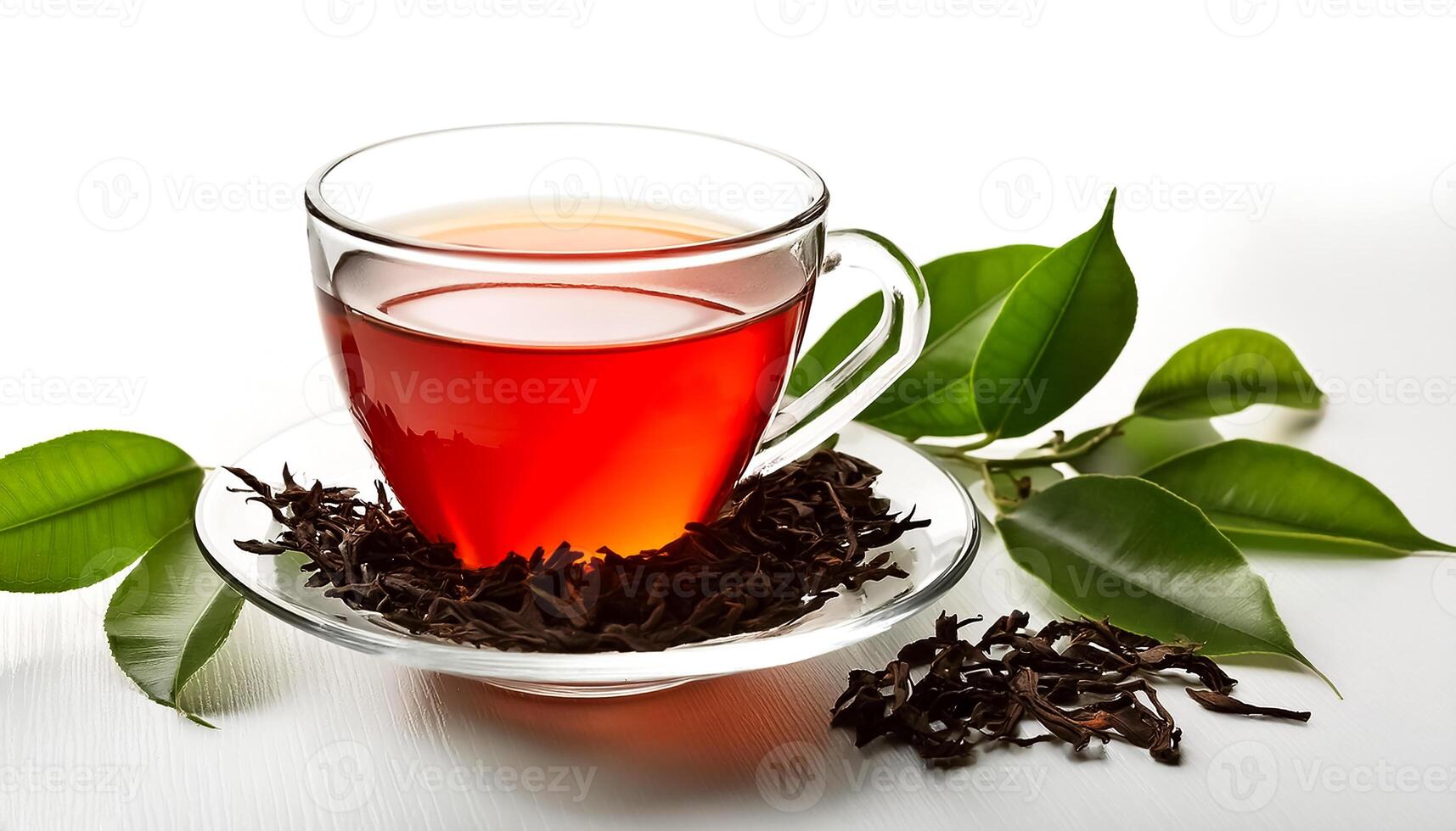 Glass cup of hot aromatic tea with leaves on clear white background photo