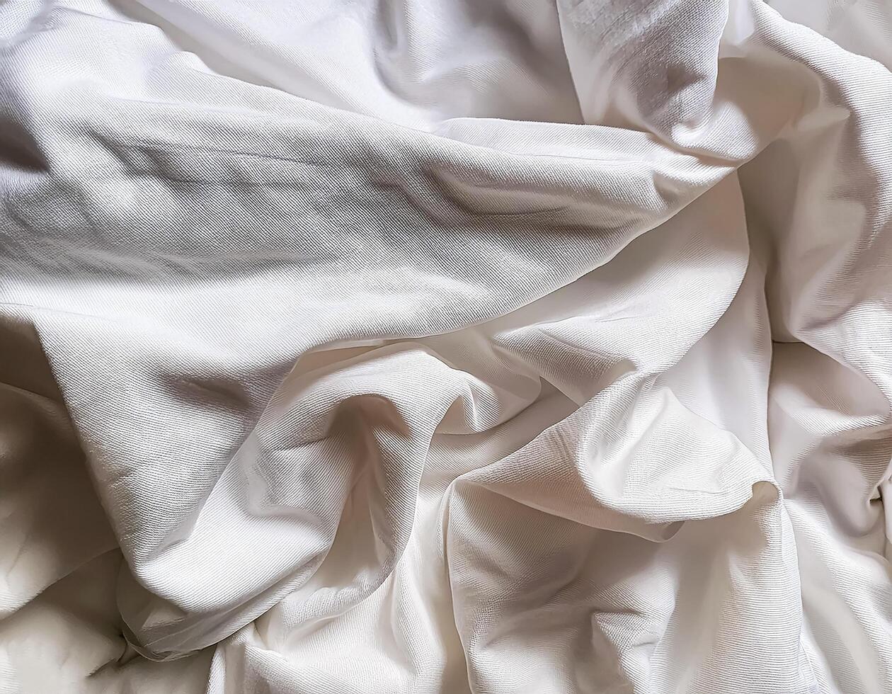 Background concept. Soft bed sheets that are still wrinkled after being used. The white bed sheets were crumpled and shabby. Pattern texture background. photo